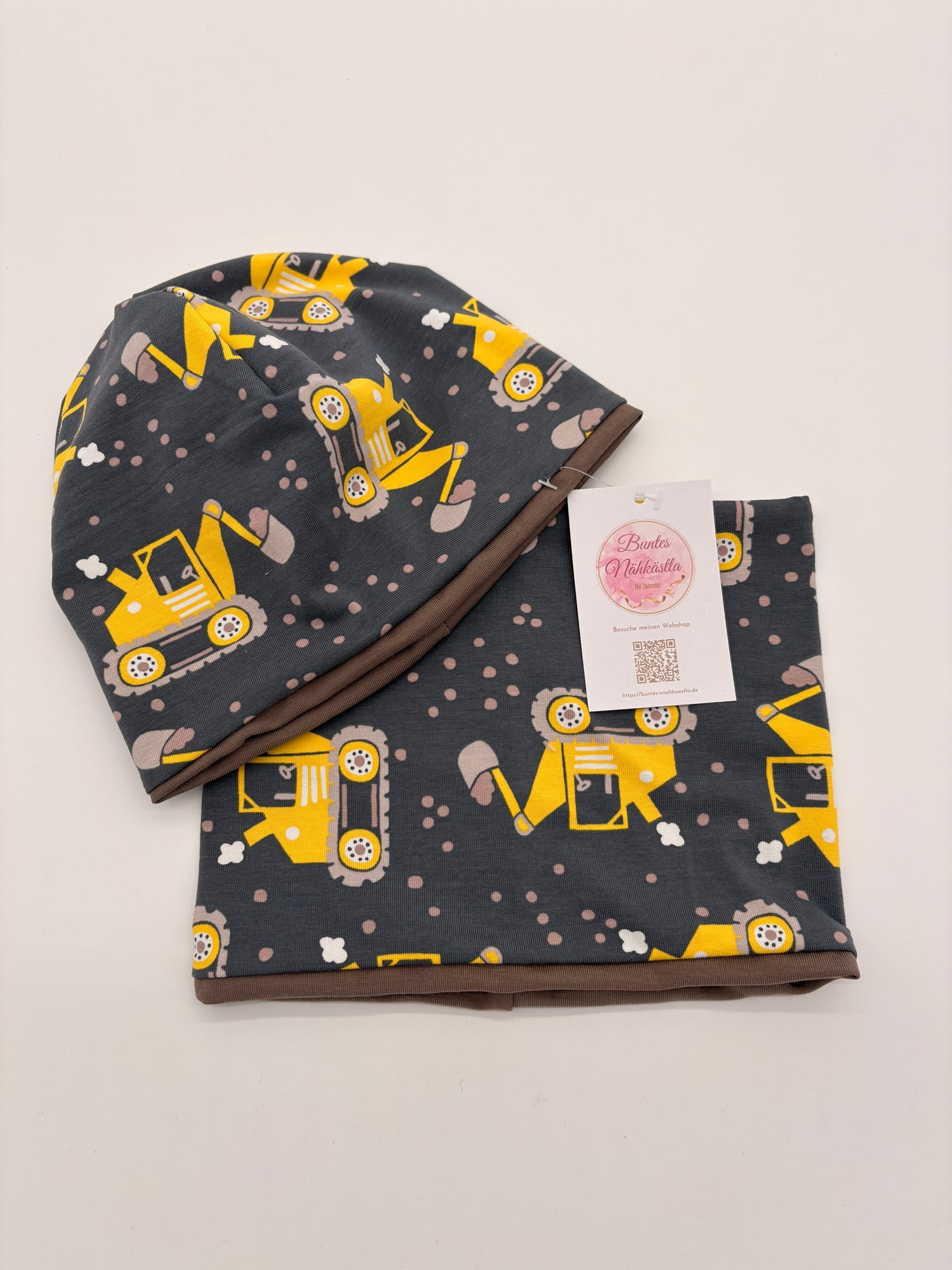 Mütze und Loop gelber Bagger